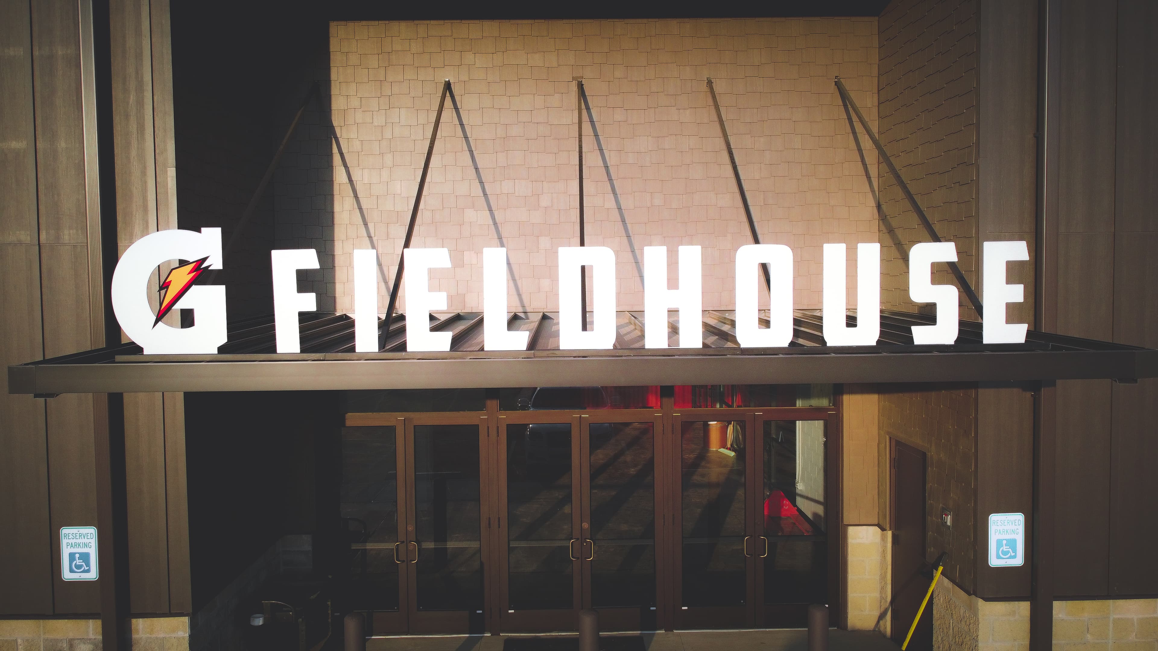 The Gatorade Fieldhouse entrance sign — illuminated G-Fieldhouse marquee above the front doors.