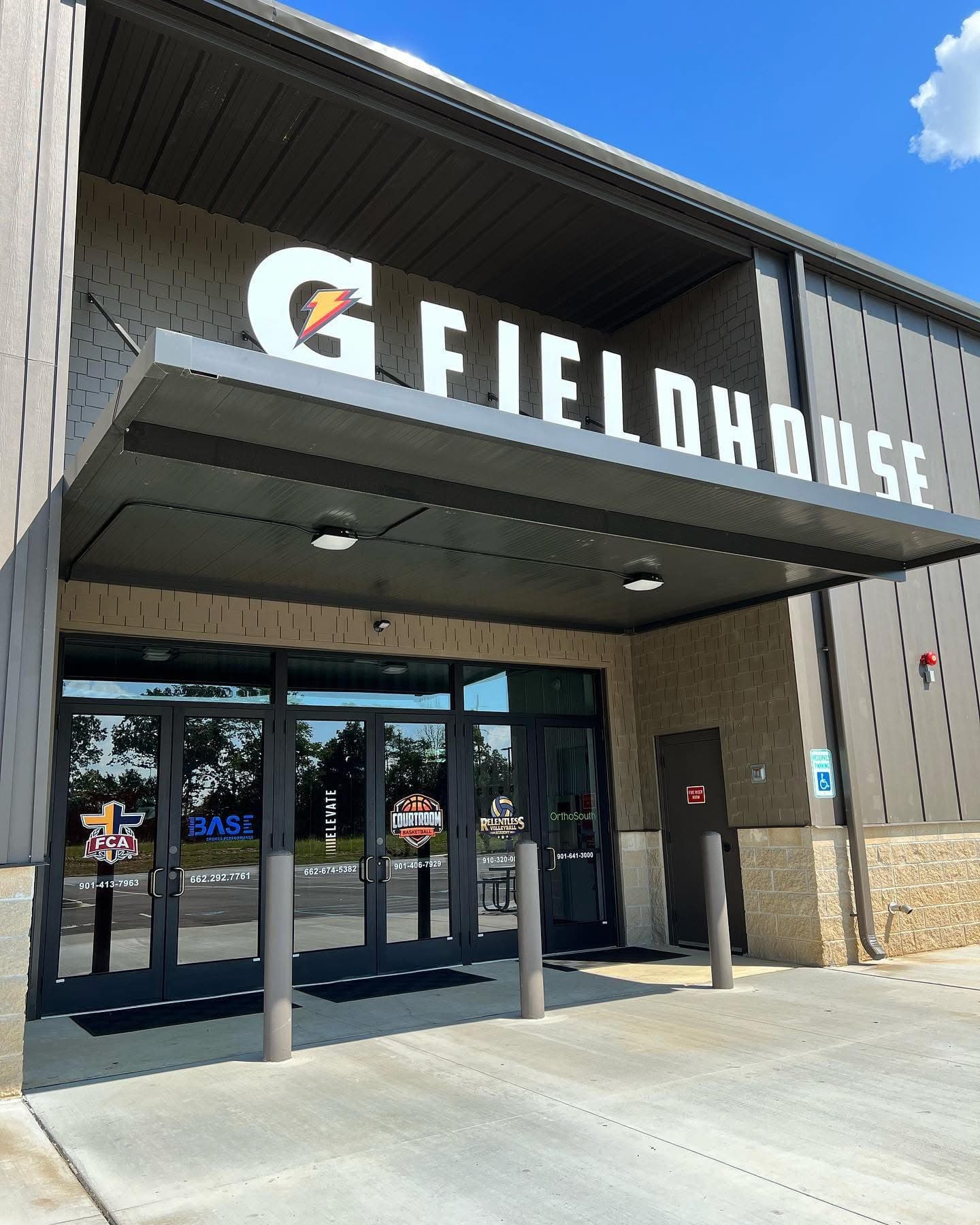 The front entrance of The Gatorade Fieldhouse under the G Fieldhouse sign