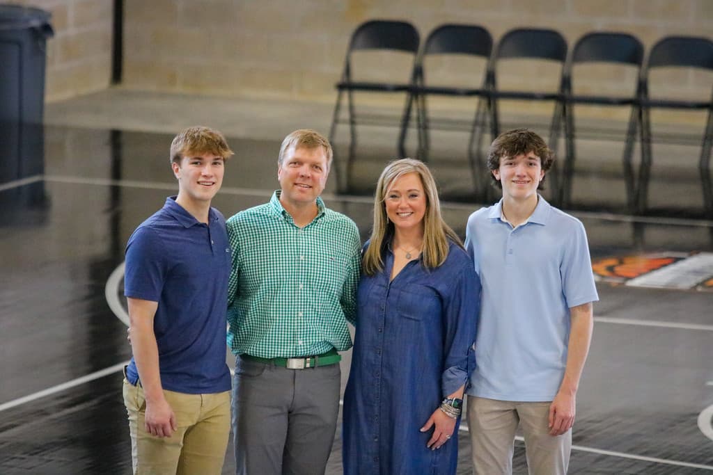 Greg and Meredith Drumwright with their two sons inside The Gatorade Fieldhouse — the family behind the complex.