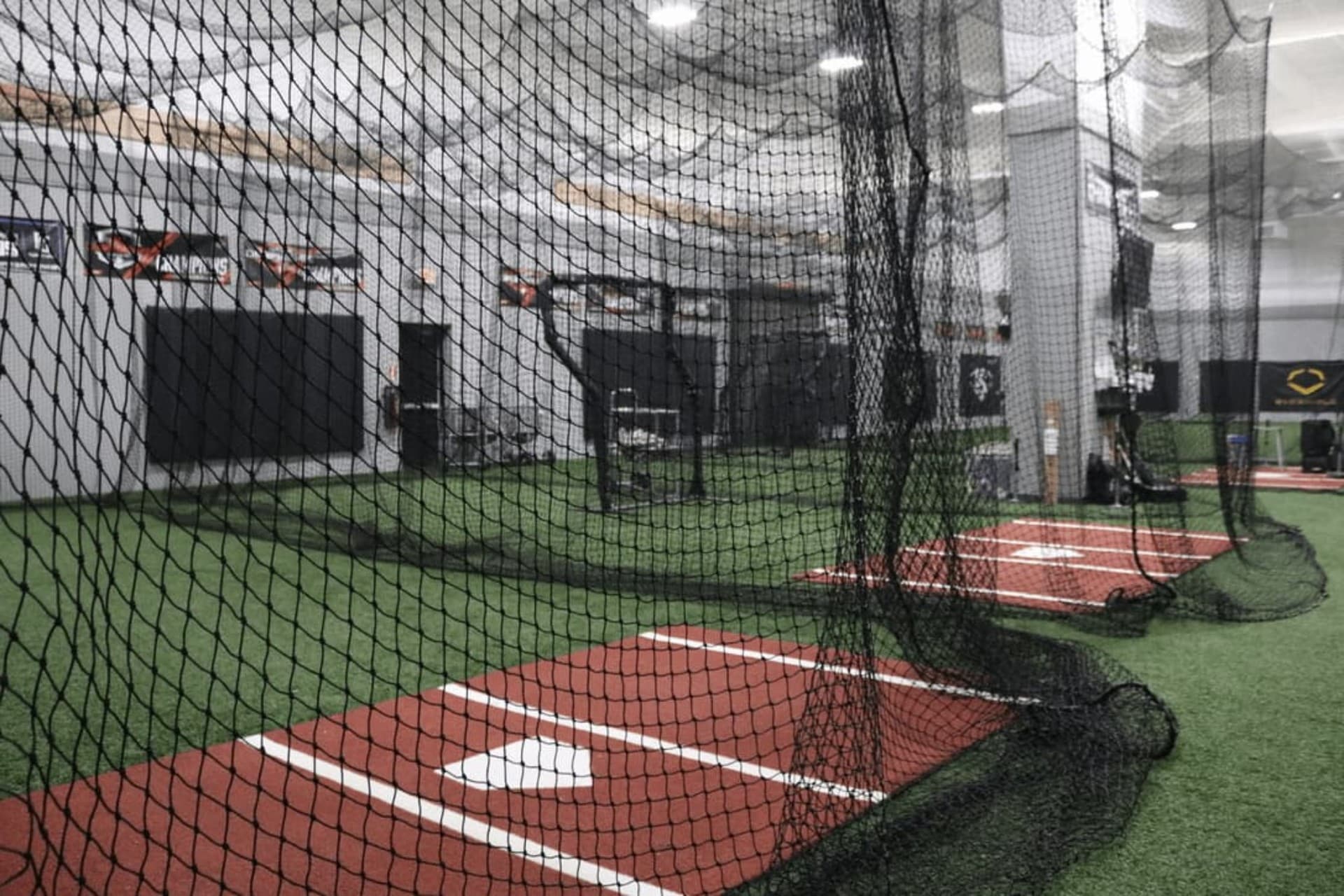 Inside the motorized batting cages at Elevate Hernando